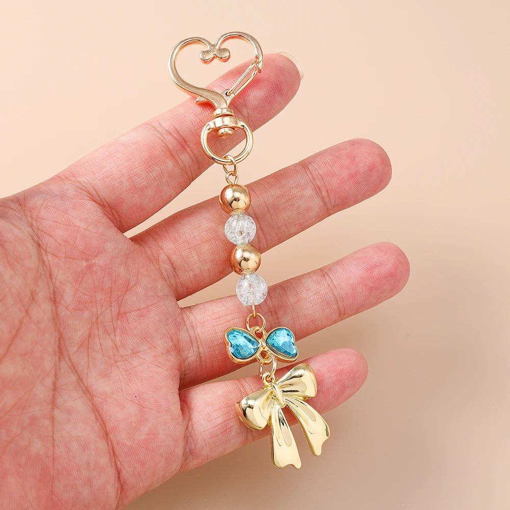 Porte - clé Perle <br> Le Ruban bleu - Doré