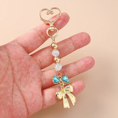 Porte - clé Perle <br> Le Ruban bleu - Doré