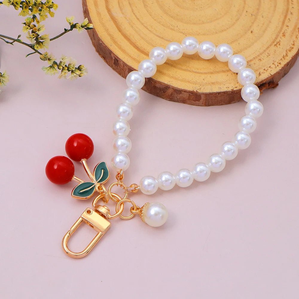 Porte - clés Bijou <br> La Cerise perlée dorée - Cerise