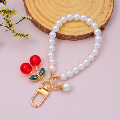 Porte - clés Bijou <br> La Cerise perlée dorée - Cerise